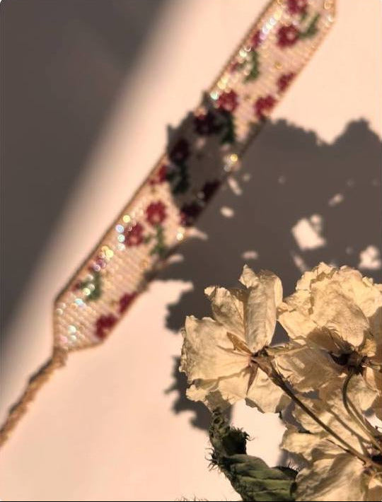 Decorative ribbon with floral patterns on a textured surface
