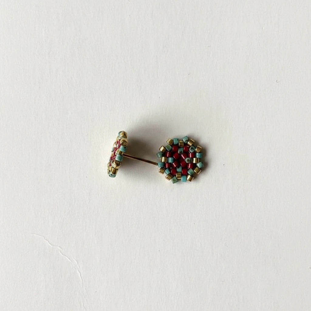 Multicolored beaded earrings on a white background