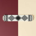Black and white patterned bracelet on a black and white background