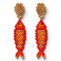 A pair of handmade beaded fish drop earrings featuring red, orange, and gold seed beads on a plain white background.