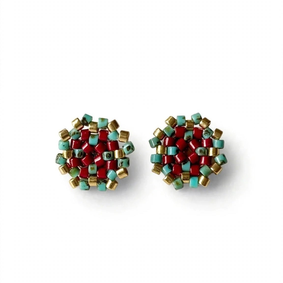 Pair of light blue shell-shaped earrings on a white background